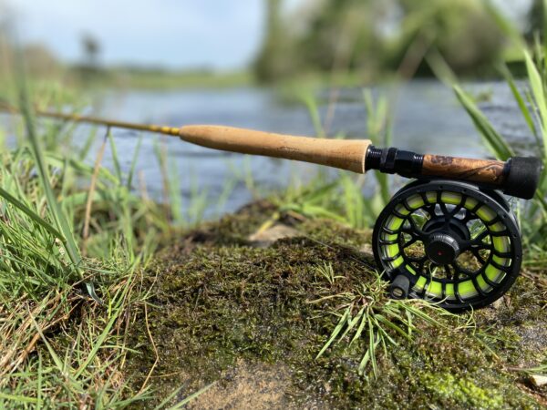 Fly rod with half-wells cork handle and wooden reel seat