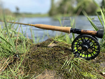Fly rod with half-wells cork handle and wodden reel seat